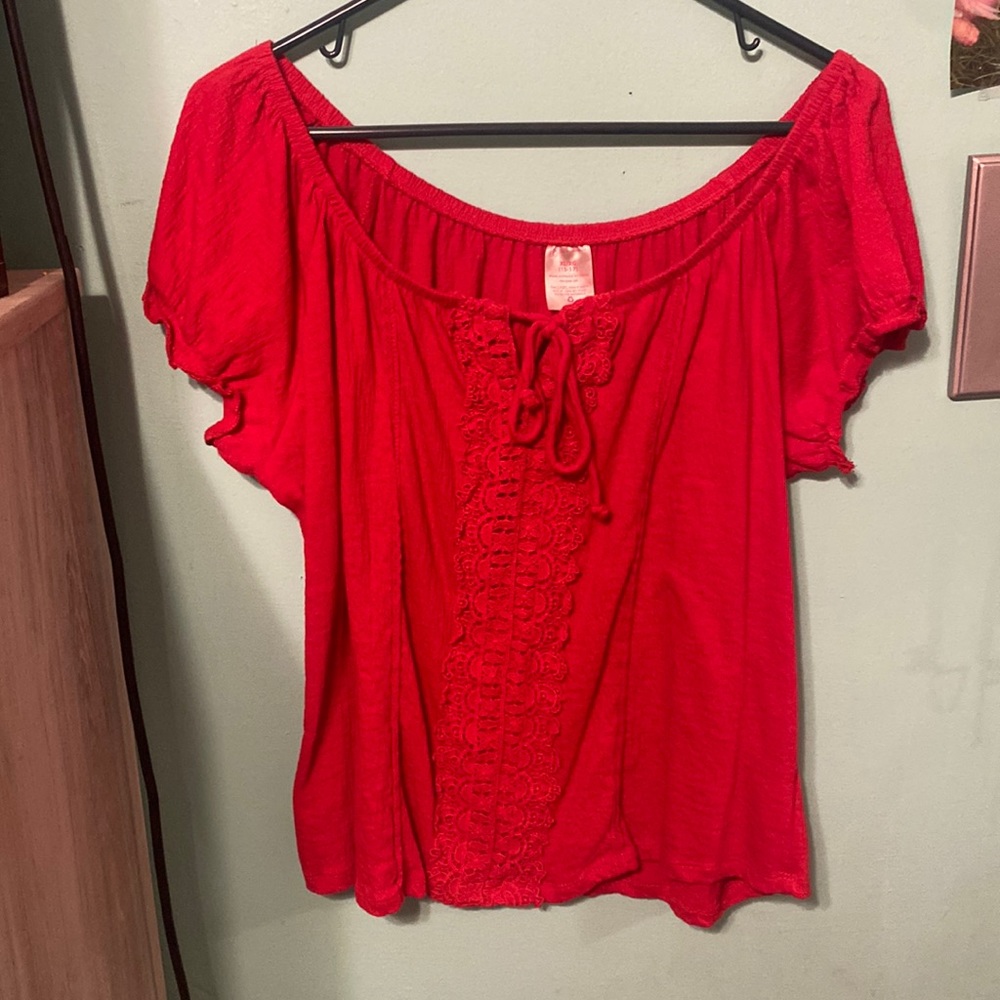 A red shirt been worn twice